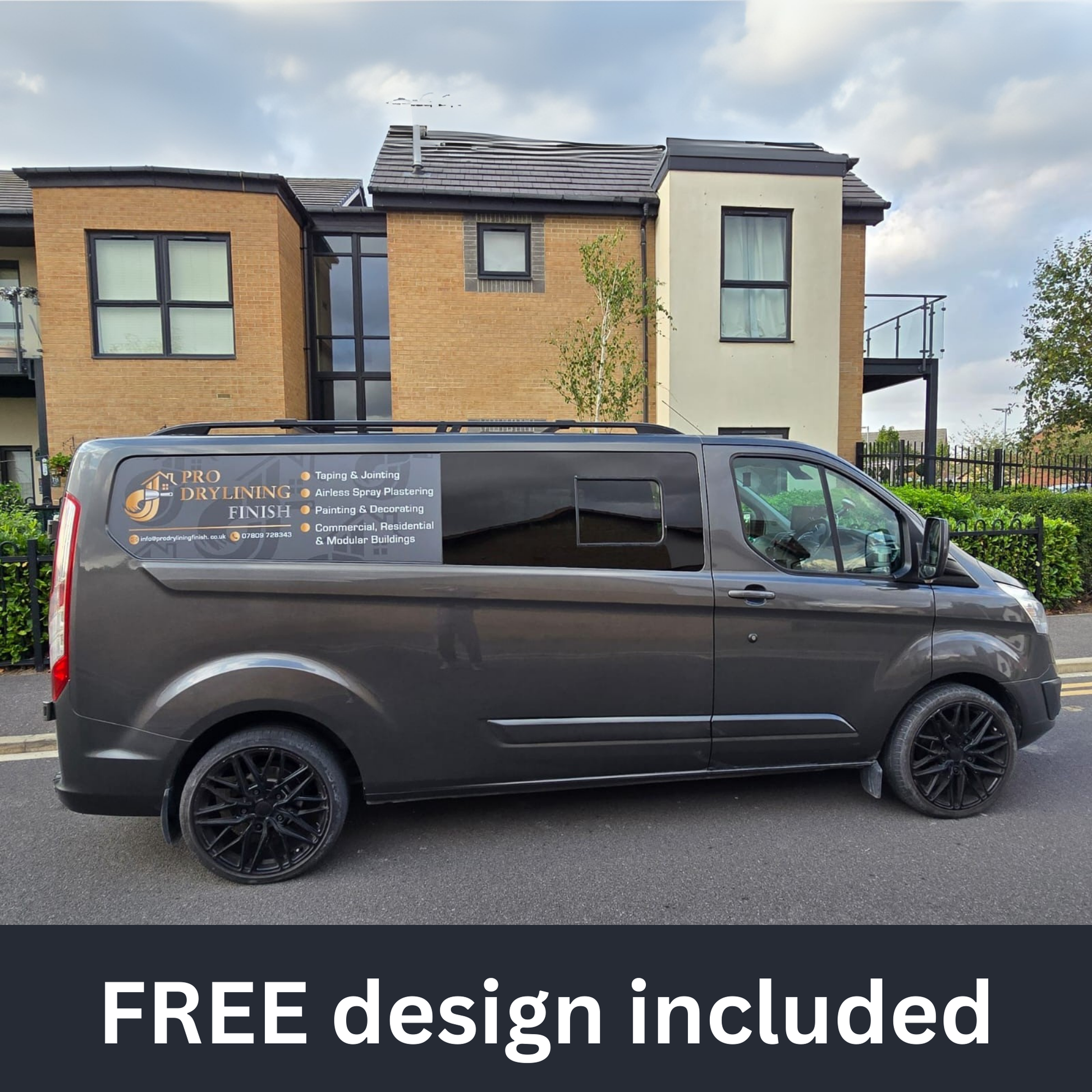 Gray van with a business advertisement on the side parked in front of a building.